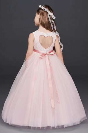 Quinceanera ball gown for flower girl, a little girl wearing a pink dress with a bow