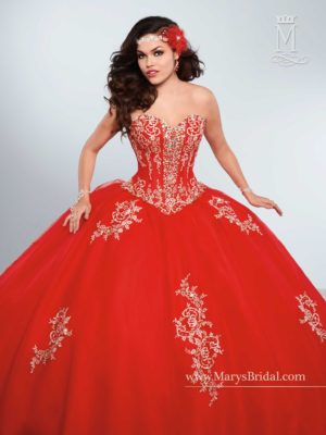 Quinceanera - A woman in a red ball gown posing for a picture