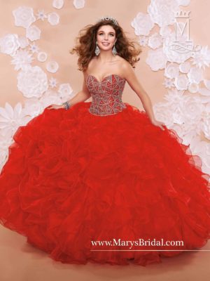 Quinceanera gown, a woman in a red dress posing for a picture