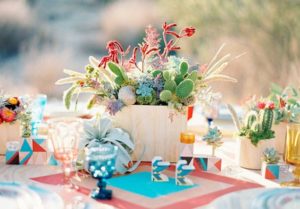 Quinceanera centrepiece, a table setting with succulents and flowers