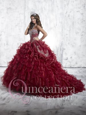 Quinceañera dresses in deep red color, a woman in a red dress posing for a picture