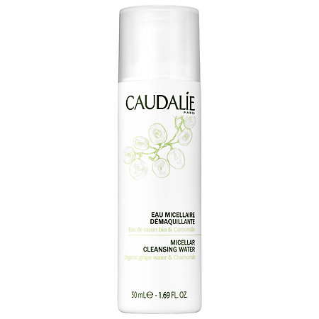Quinceanera-themed image: A bottle of caudalie cleanser and lotion on a white background