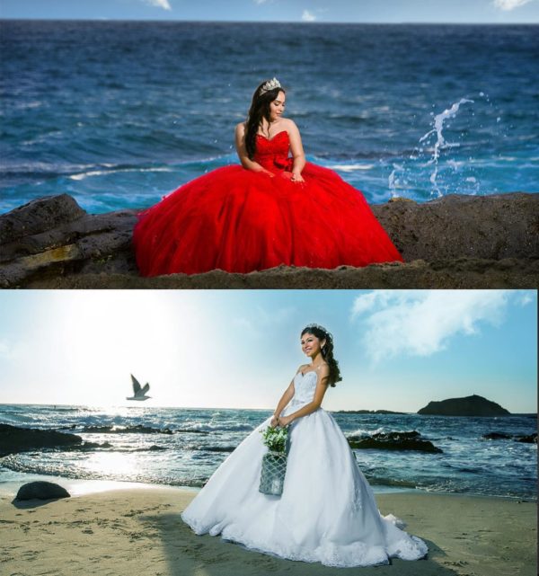 A woman in a red dress sitting on a rock near the ocean wearing a Quinceanera gown