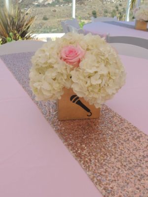 Quinceanera floral design with a table featuring a vase of flowers