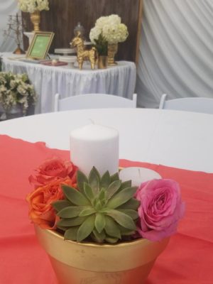 Floral design, a table topped with a gold bowl filled with flowers