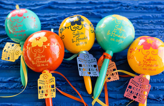 Quinceanera party with a bunch of colorful balloons with writing on them, fiesta themed favor ideas