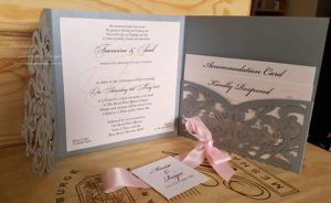 Quinceanera invitation Gold, a couple of cards sitting on top of a table