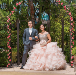 Floral design Quinceanera dress, a man and a woman posing for a picture