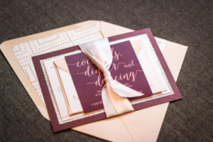 A close up of a Quinceanera invitation on a table