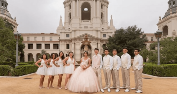 Quinceanera Court, a group of people standing in front of a building