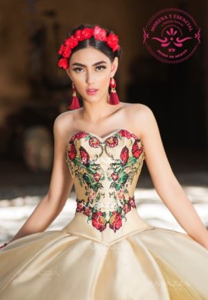 A woman sitting on the ground wearing a Quinceañera dress with a Mexican corset