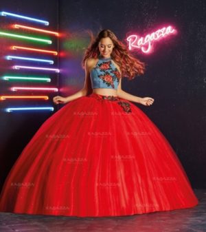 Quinceanera: A woman in a red dress standing in front of a neon sign, wearing a Quinceanera gown.