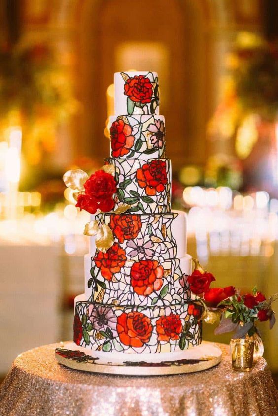 Quinceanera cake, a cake with red flowers on a table, inspired by Beauty and the Beast