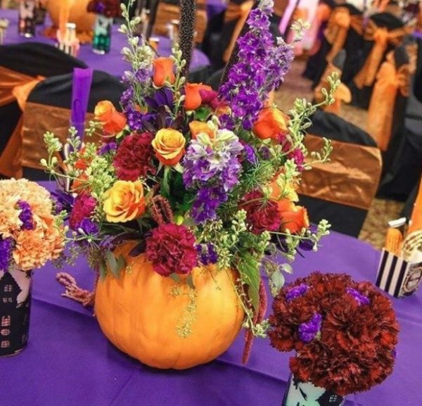 Flower bouquet and floral design on a table with a purple table cloth