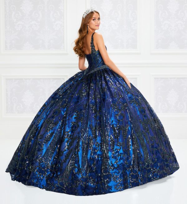 Quinceanera: A woman wearing a blue and black gown