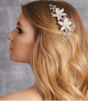 A woman with long blonde hair wearing a Quinceanera hair comb
