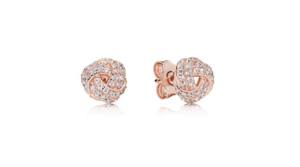 A pair of rose gold earrings with diamonds for a Quinceanera