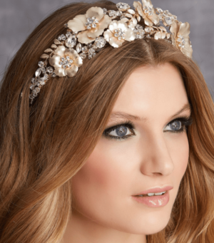 A woman with long hair wearing a tiara, perfect for a Quinceanera celebration.