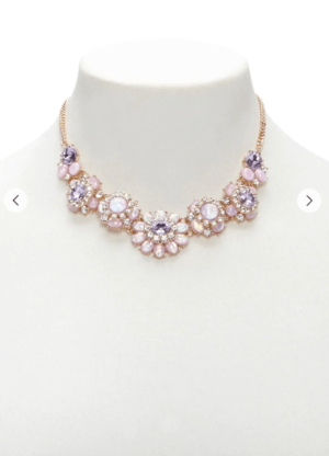A white mannequin wearing a necklace, featuring pink and purple colors, perfect for a Quinceanera.