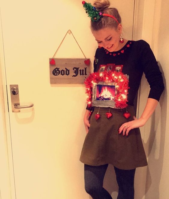 Quinceanera costume: A woman standing in front of a door wearing a funny Christmas outfit