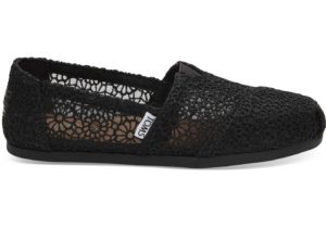 A pair of women's black slip-on shoes on a white background, perfect for a Quinceanera