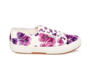 A pair of lilac Quinceanera trainers with flower embellishments