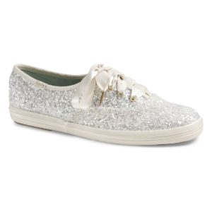 A white shoe with silver glitters on it, perfect for a Quinceanera celebration.