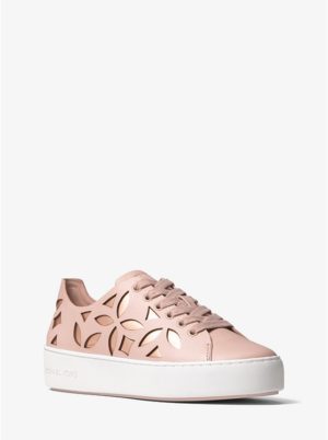 A pair of Michael Kors Quinceanera sneakers. The sneakers are made of pink leather and feature cut outs.