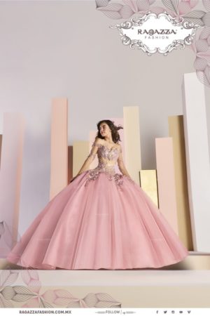 Quinceañera color dresses - a woman in a pink ball gown posing for a picture