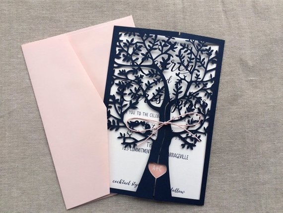 Quinceanera Invitation, an elegant card with a tree cut out of it in pink and navy blue