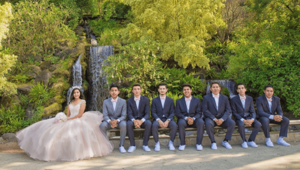 quinceanera_posing_with_chambelanes