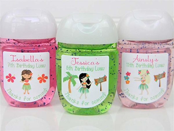 A white surface with three bottles of personalized toothpaste featuring a cream Quinceañera design