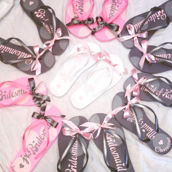 A Quinceanera-themed sandal, featuring a circle of pink and black flip flops