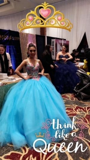 Quinceanera gown, a woman in a blue dress and a crown