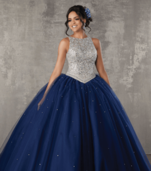 A woman posing for a picture in a ball gown Quinceañera dress