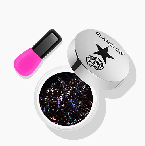 Quinceanera image: A container of glitter next to a pink nail brush, representing the glitter GLAMGLOW GRAVITYMUD Firming Treatment.