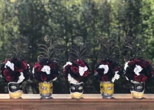 The Phantom of the Opera, a row of vases filled with red and black flowers