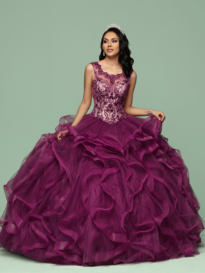 Quinceanera gown, a woman posing for a picture in a purple dress