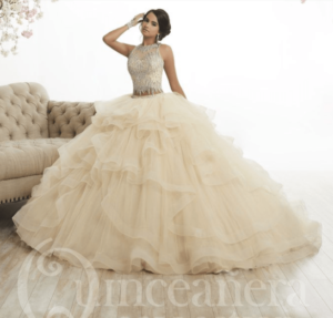 Two piece Quinceañera dresses, a woman in a ball gown posing for a picture