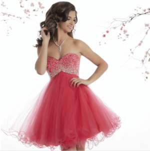 Quinceanera: A woman wearing a red cocktail dress posing for a picture