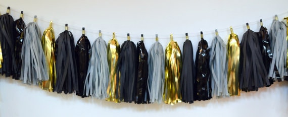 Quinceanera: a black and gold party garland with tassels