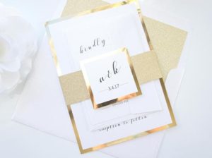 A close up of a Quinceanera invitation on a table