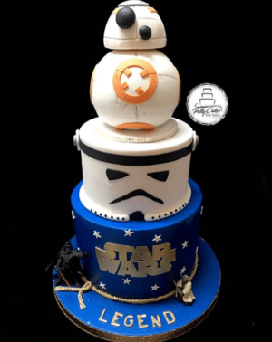 A Quinceanera themed cake with a Star Wars theme featuring a BB-8 robot on top