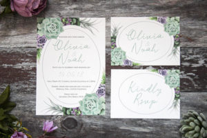 Quinceanera Invitation, a couple of Quinceanera invitations sitting on top of a wooden table