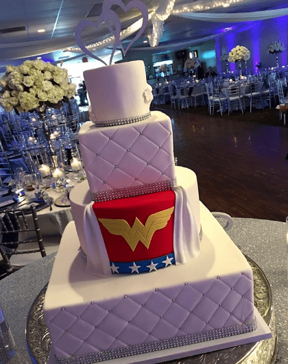Quinceanera cake, a Quinceanera cake with a wonder wonder logo on it