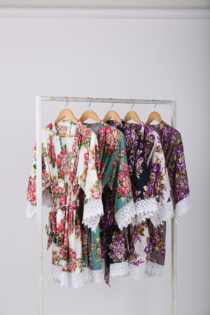 A Quinceanera themed clothes hanger displaying a variety of robes hanging on a rack