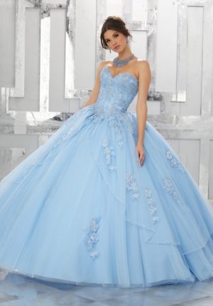 Two pictures of a beautiful princess in a blue Quinceañera dress