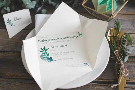 Quinceanera invitation, a white plate topped with a white napkin