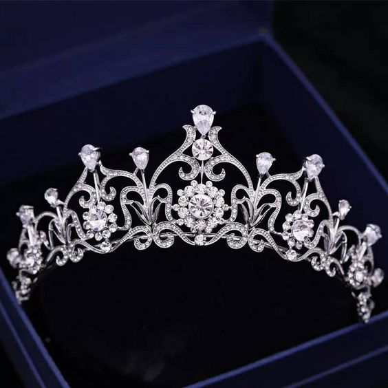 Quinceanera image: A princess silver crown Tiara, a tiable in a box on a black background