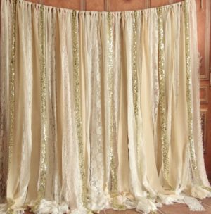 A Quinceanera-themed image featuring a curtain with gold sequins hanging from it